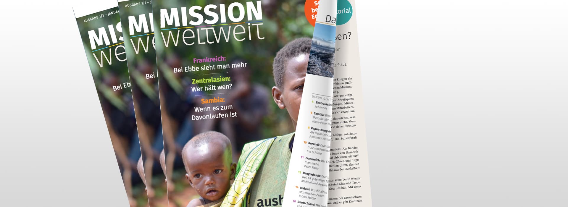 Drei Ausgaben des Magazins Mission weltweit, mit einer Frau und einem Kind auf dem Titelblatt, teilweise aufgeschlagen auf einer Innenseite.